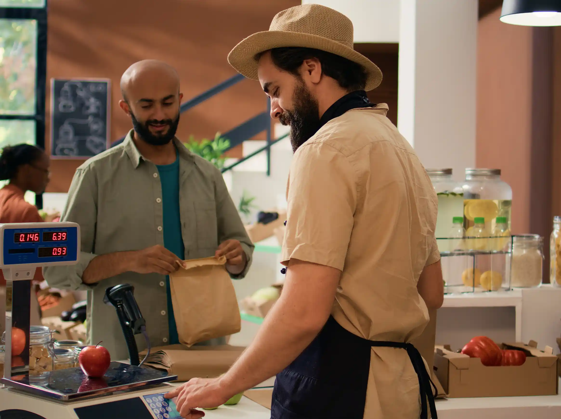 Retail store team serving a customer at checkout — retail technology enterprise powers agile delivery with Smartsheet implemented by Virtuos Digital